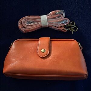 Orange Leather Clutch/Crossbody Bag w/detachable strap. Perfect condition.